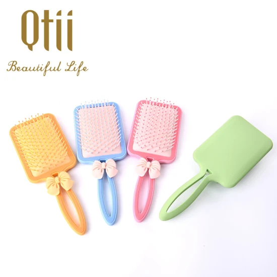 Nouvelle brosse à cheveux de massage à coussin d'air en forme de pagaie avec peinture douce au toucher et avec décoration d'arc